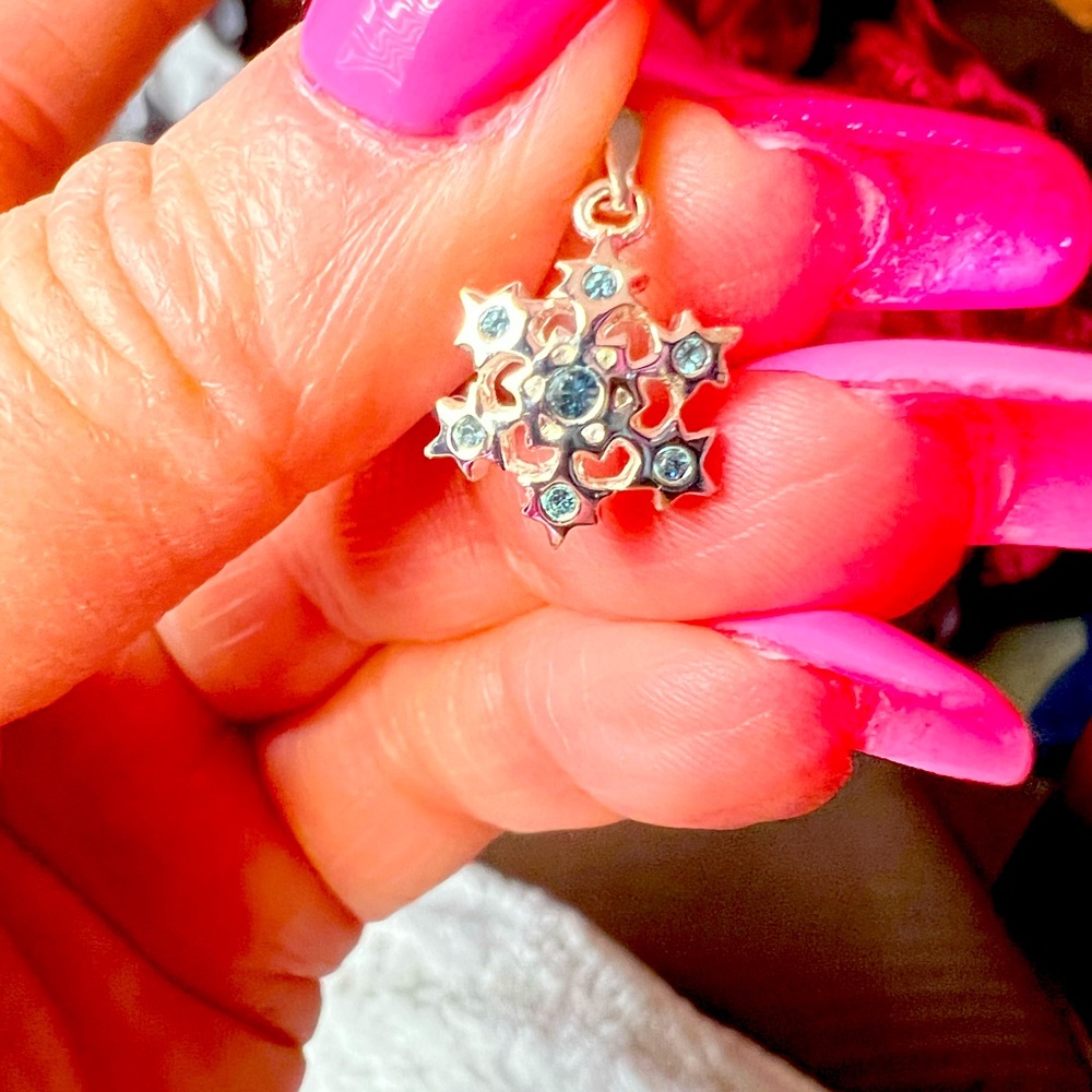 Sterling silver snowflake charm with aquamarine tips
